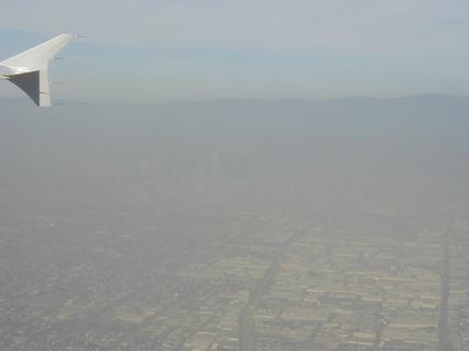Downtown LA (through the smog).  It's there, really! <br>Location: <a href="https://www.google.com/maps/search/?api=1&query=33.94347,-118.23508" target="_new">Over California</a>